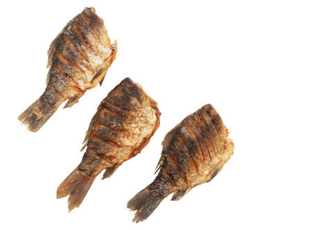 Fried fish isolated on a white background. Close-upの写真素材
