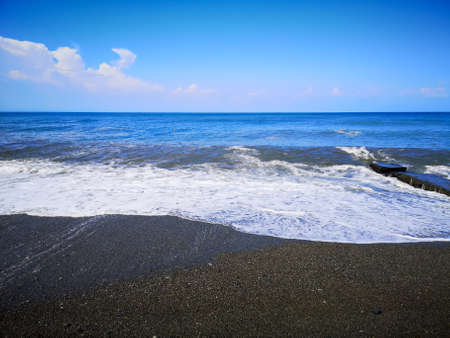 Water on the pebble sea shore as a background.の写真素材