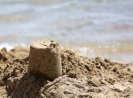 Sand building on the beach by the sea.の写真素材