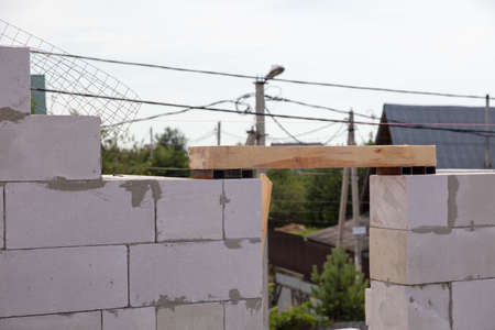 Construction of the walls of the house from foam concrete bricks. Technologyの写真素材