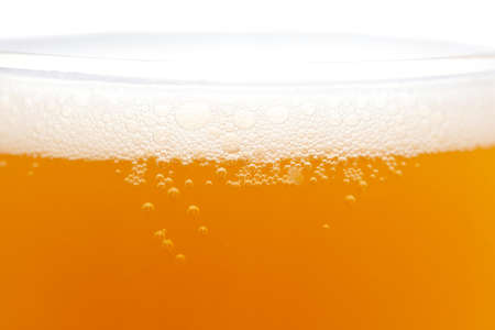 Mug of foamy beer isolated on white background. Close-upの写真素材