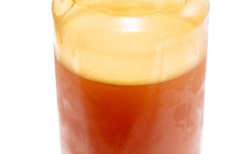 Plastic bottle with beer isolated on a white background. Close-up