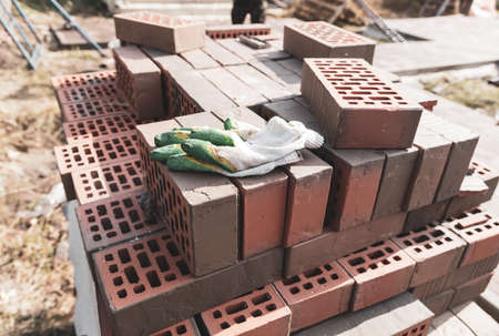 Red burnt brick at a house construction site. Construction materialの写真素材