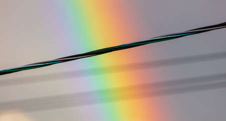 Electric wires on a rainbow background. Nature