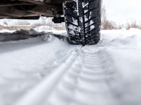 Car wheel in the snow. Winter