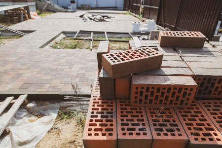 Red burnt brick at a house construction site. Construction materialの写真素材