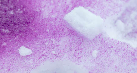 Purple paint on the snow in winter. Abstract background.