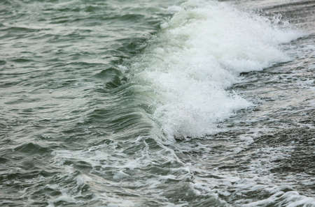 Wave in the sea with splashing water. Abstract background