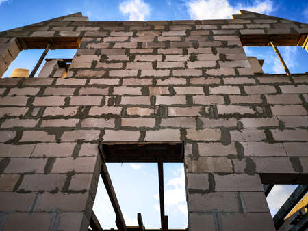 Foam block house under construction at sunset. Technology
