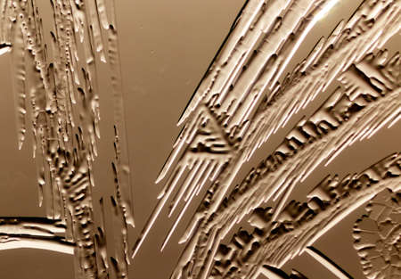 Patterns from frost on glass as a background. Close-up