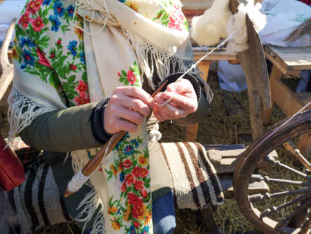 Wool yarn by hand on a loom. The old methodの写真素材