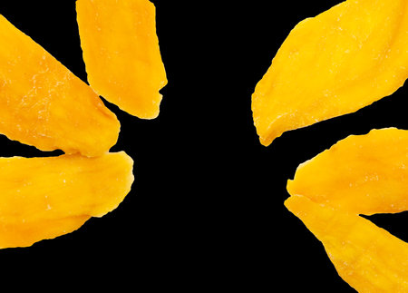 Dried mango isolated on black background. Close-upの写真素材