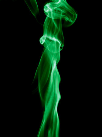 Green smoke isolated on black background.の写真素材