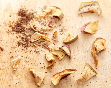 Worms in dried apples on a wooden background.の写真素材