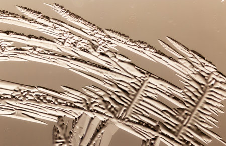 Patterns from frost on glass as a background. Close-up