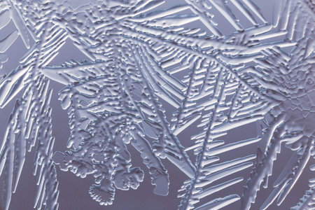 Blue patterns from frost on glass as a background. Close-upの写真素材