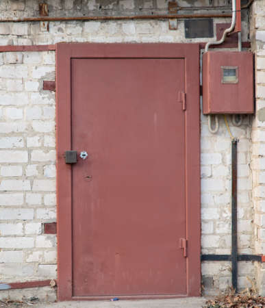 Metal gate in the old mountain house as a background.の写真素材