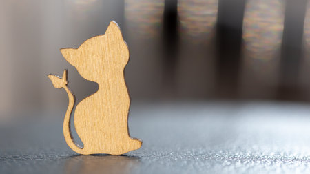 Close up of toy wooden cat silhouette.の写真素材