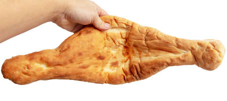 Fresh tortilla in hand isolated on white background. Bread