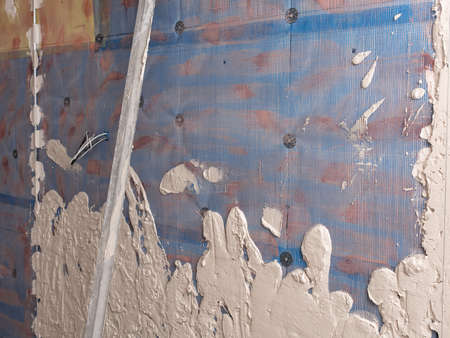 Wall covered with plaster as an abstract background. Building a house