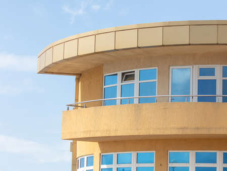 Mirrored glasses on the building against the blue sky.の写真素材