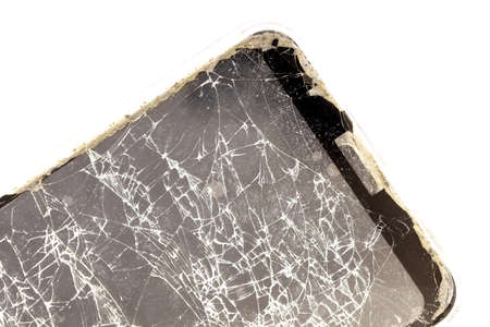 Broken glass of the phone on a white background. Close-up