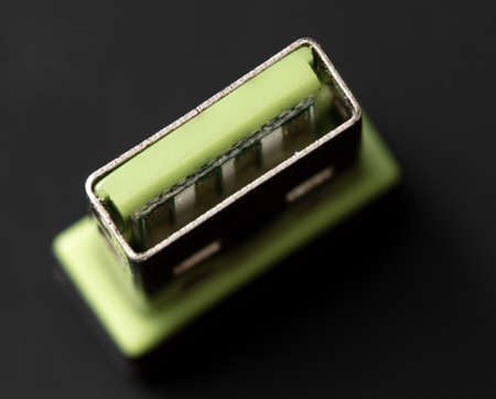 Flash drive on a black background. Close-up