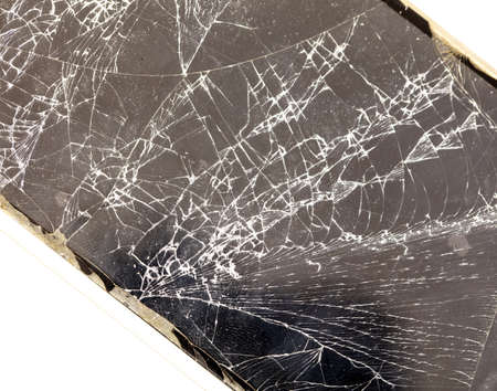 Broken glass of the phone on a white background. Close-up