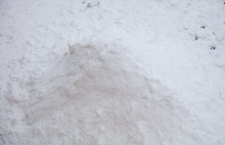 A slide of snow on the ground in winter.の写真素材