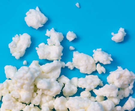 Milk curd on a blue background. Close-upの写真素材