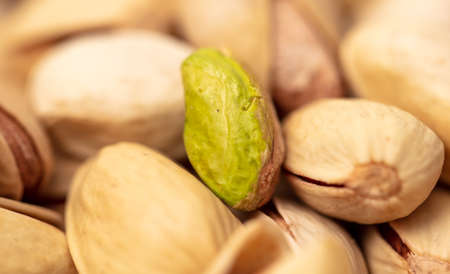 Close-up of fresh pistachio nuts as background. Macro