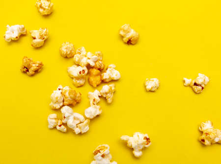 Close-up of popcorn on a yellow background. Macroの写真素材