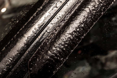 Ice on the car. Rain in winterの写真素材