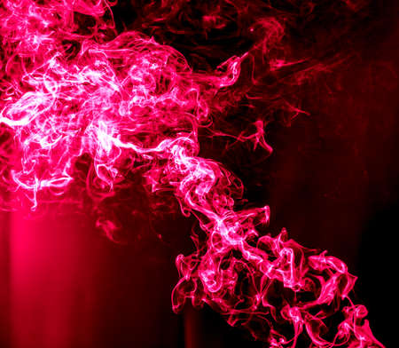 Red smoke isolated on black background. Abstraction