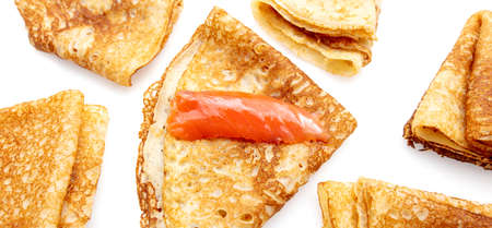 Pancake with red fish fillet on a white background.の写真素材