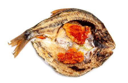 Dried fish with caviar isolated on a white background.