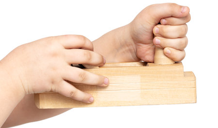 Wooden plane in hands isolated on a white background. Close-upの写真素材