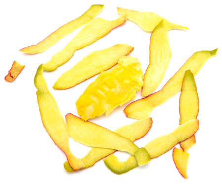 Peeled mango skins on a white background. Close-up