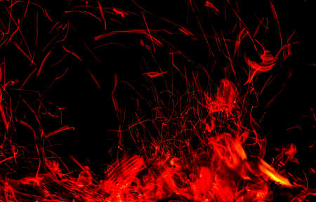 Sparks from fire on a black background.