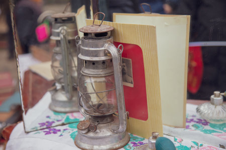 Lipetsk, Russia -May 9, 2021: Kerosene lamp on the table in the park. Holiday Victory Day over...
