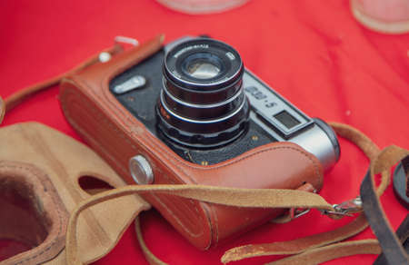 Lipetsk, Russia -May 9, 2021: Antique photo camera on the table in the park. Holiday Victory Day over fascist Germany.のeditorial素材