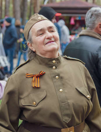 Lipetsk, Russia -May 9, 2021: People in military uniforms walk in the park. Holiday Victory Day over...