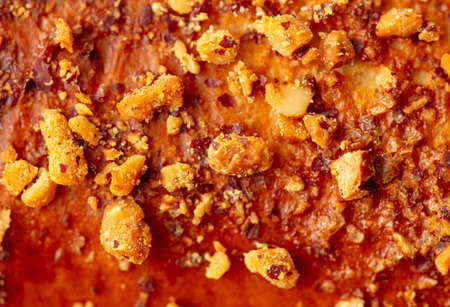 Ruddy crust on a sweet bun as a background. Close-upの写真素材