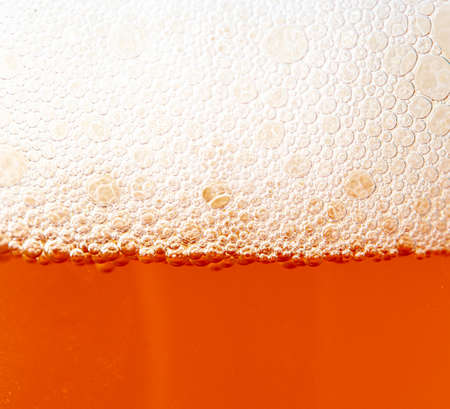 Fresh beer in a mug as a background. Close-upの写真素材