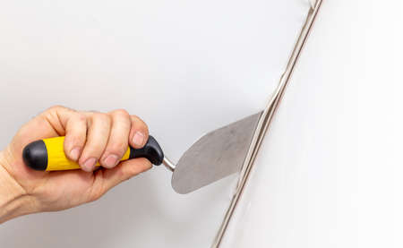 The technology of stretching the stretch ceiling in the room. Home renovation