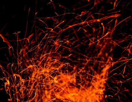 Sparks from fire on a black background.の写真素材
