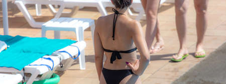 Girl in a swimsuit near the pool.の写真素材