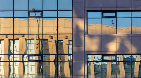 Mirrored windows in the building as a background.の写真素材