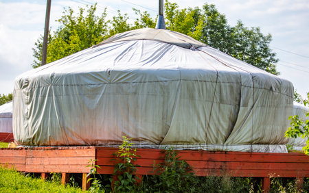 Yurt in the park in summer. Dwelling of asians