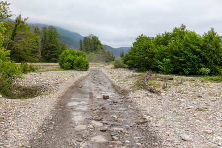 Dirt road in a mountainous area in nature.